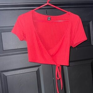 Red SHEIN crop top. One side sewn into shirt, the other ties to the opposite